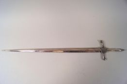 A sword shaped white metal skewer,