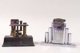 An Art Deco French chrome table lighter, 8cm high, and a Ronson table lighter,