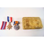 A 1914 Princess Mary brass Christmas box with Victory Medal and a 1914-15 Star.