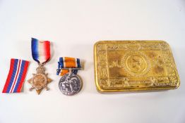 A 1914 Princess Mary brass Christmas box with Victory Medal and a 1914-15 Star.