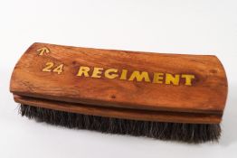 An Army boot brush with brass 24th Regiment inlay