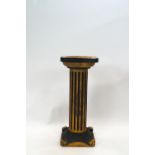 A Classical style carved and painted column stand,