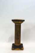 A Classical style carved and painted column stand,