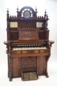 A Victorian carved hardwood harmonium by the Chicago Cottage Organ Company via Crane and Sons,