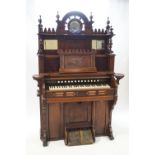 A Victorian carved hardwood harmonium by the Chicago Cottage Organ Company via Crane and Sons,