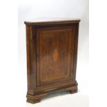 A George IV oak and mahogany floor standing corner cupboard,