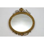 A 19th century circular giltwood wall mirror,