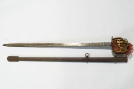A Scottish sword with a pierced and decorated brass guard to a plain steel blade cased in a metal