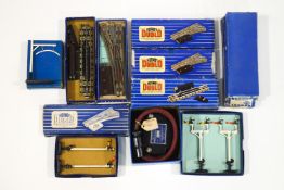 A quantity of Hornby Dublo signals, points and a transformer,