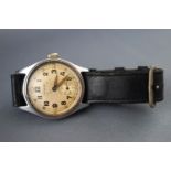 A WWII Timor military wrist watch with leather strap, engraved ATP.