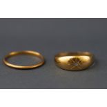 A 22ct gold wedding ring (worn) and 18ct gold gypsy set rose cut diamond ring.