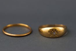 A 22ct gold wedding ring (worn) and 18ct gold gypsy set rose cut diamond ring.
