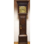 A 19th century 30 hour long case clock in a heavily carved oak case,