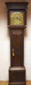 A 19th century 30 hour long case clock in a heavily carved oak case,