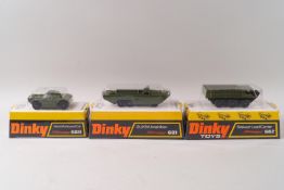 A Dinky DUKW amphibian No 681, a Stalwart load carrier No682 and a Ferret armoured cat No 688,