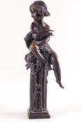 A bronze of a girl seated upon a column,