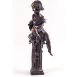 A bronze of a girl seated upon a column,