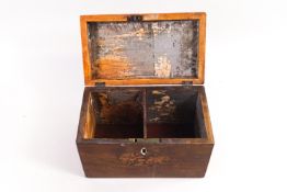 A mahogany rectangular form two compartment tea caddy, the top and front inlaid with shell motifs,