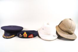 Two safari type pith helmets,