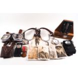 A collection of militaria, including photographs, a pair of spurs, policeman's torch and whistle,