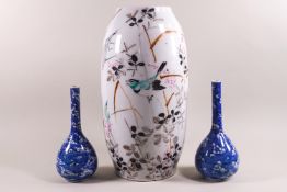 A pair of Chinese porcelain vases with bird decoration,