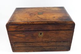 A 19th century walnut toiletry box with writing drawer