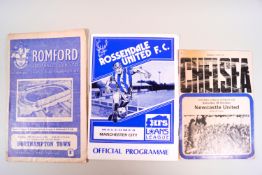 A box of assorted football programmes etc
