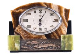 A three coloured onyx cased Art Deco eight day clock, with metal panel of running hounds, 18cm high,