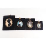 A group of three decorative miniatures and a silhouette in black Japanned frames