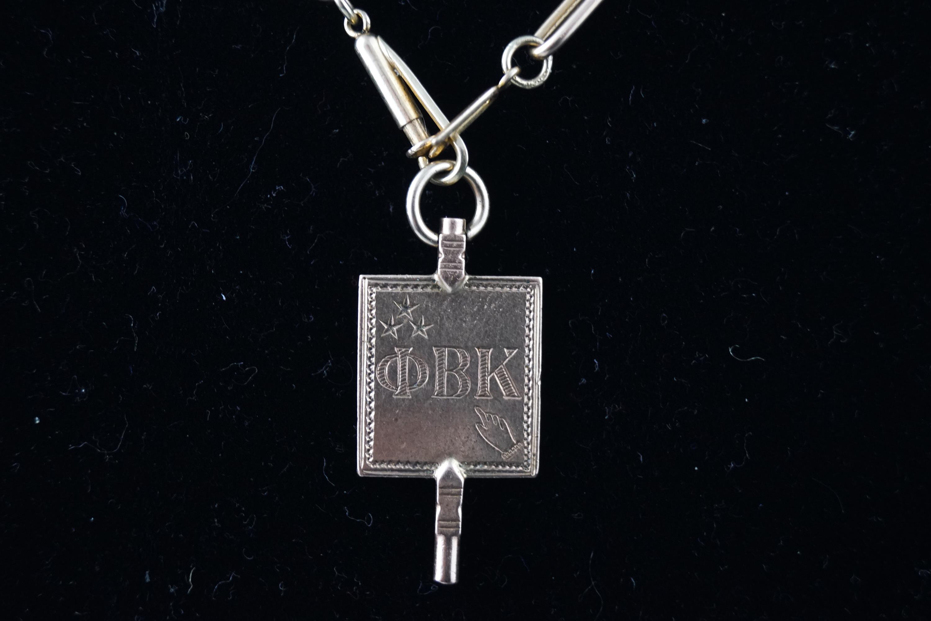 A 14ct watch chain and fob with registration number
