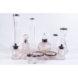 Four silver mounted glass vases, two silver mounted scent bottles and stoppers,