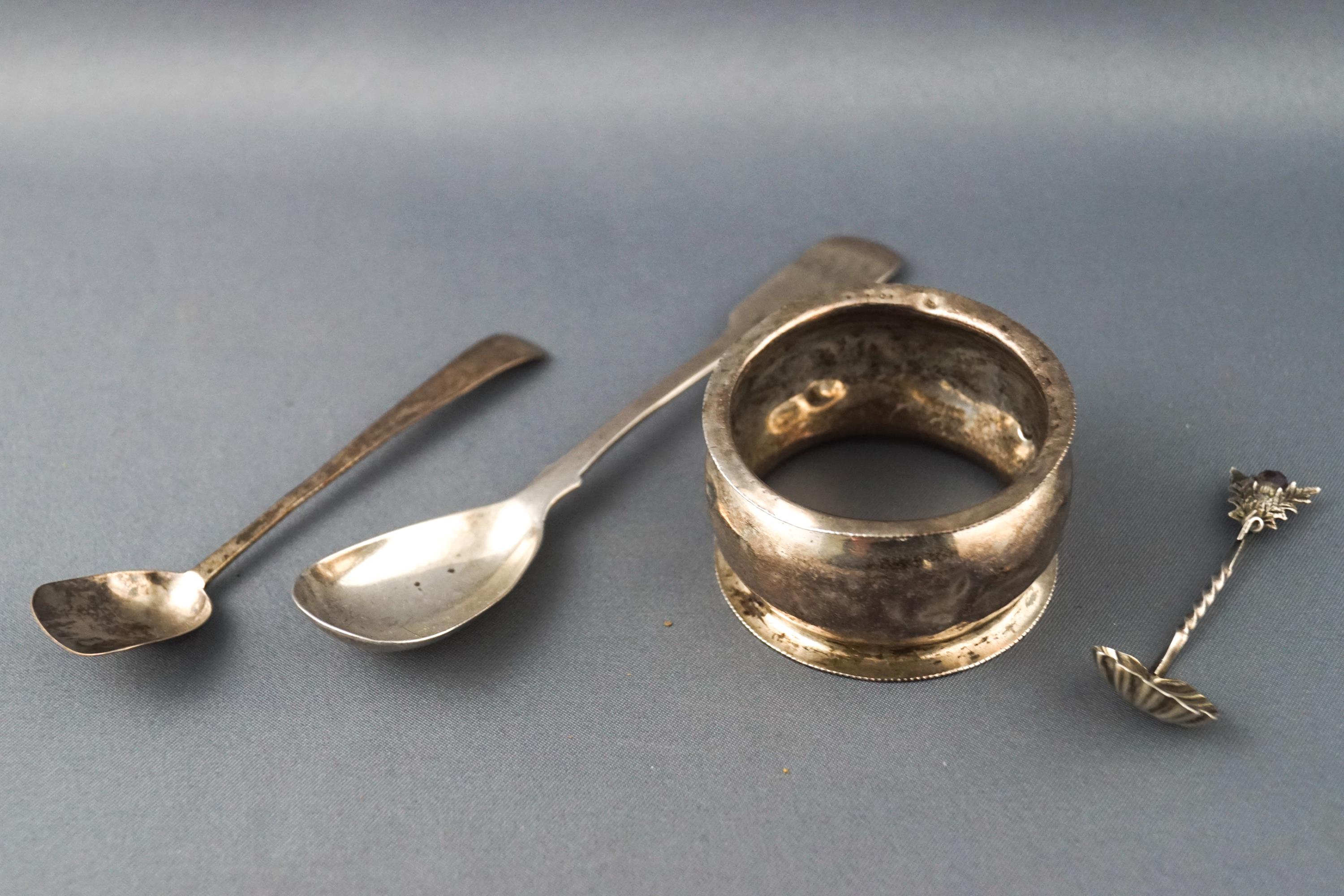A silver fiddle pattern mustard spoon, London 1821, two other spoons, one gem set,