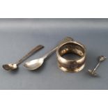 A silver fiddle pattern mustard spoon, London 1821, two other spoons, one gem set,