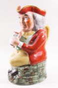 A 19th century Staffordshire pottery Toby jug, painted with coloured enamels,