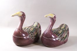 A pair of Chinese porcelain tureens and covers in the form of a duck, painted in coloured enamels,