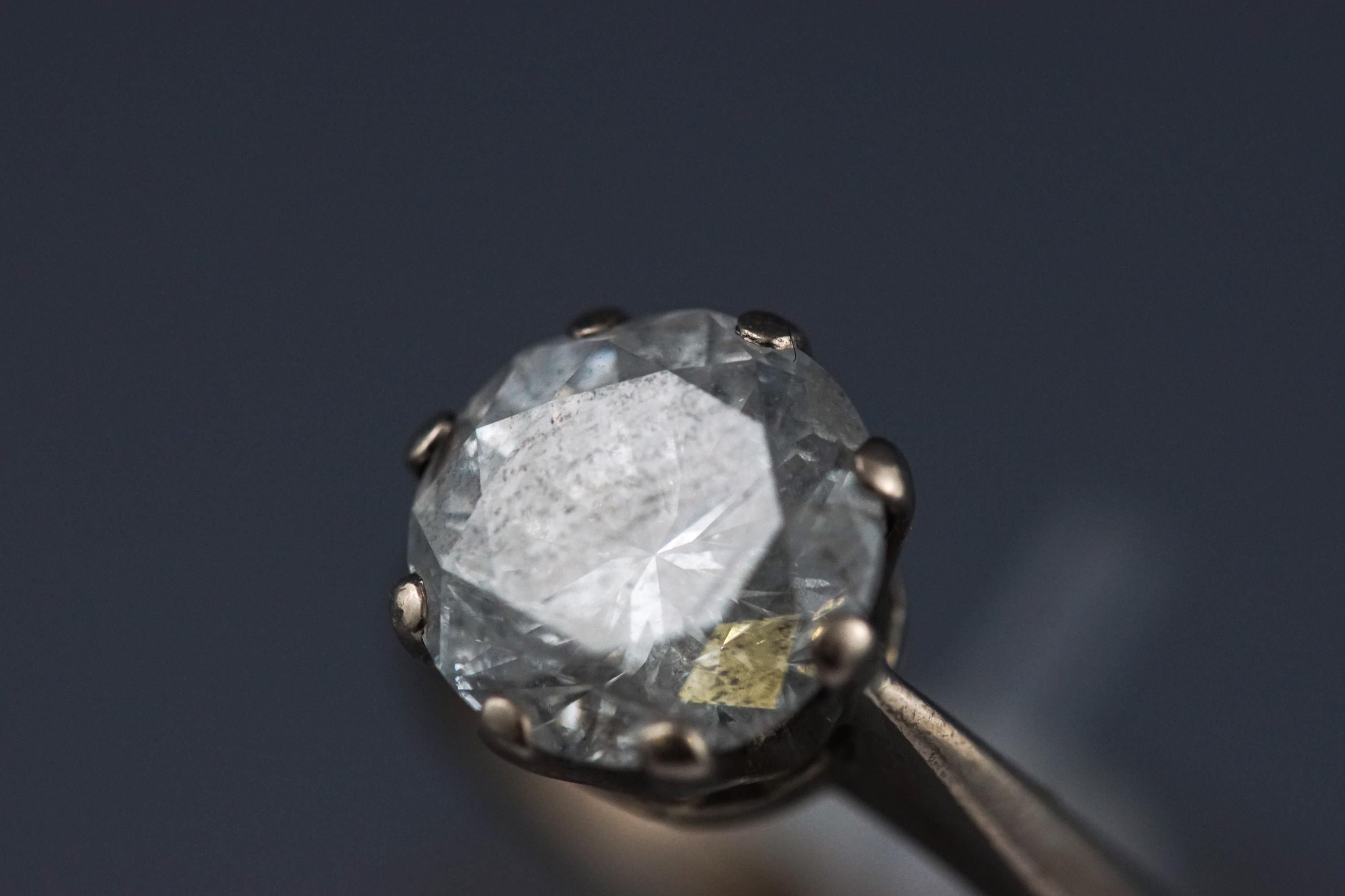 A white metal single stone diamond ring. - Image 6 of 13