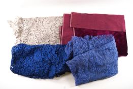 A quantity of black lace and other coloured lace