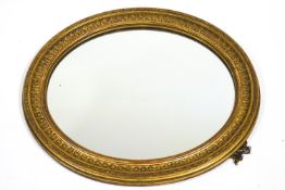 A Victorian oval gilt frame, now with mirror glass,