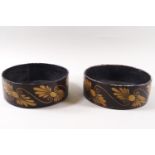 A pair of Regency papier mache coasters painted in gilt with stylised anthemions,