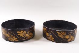 A pair of Regency papier mache coasters painted in gilt with stylised anthemions,