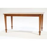 A large mahogany coffee table with rectangular top, raised on turned legs,