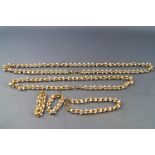 A collection of gold plated necklace, bracelet and earring set made from beads and simulated pearls.