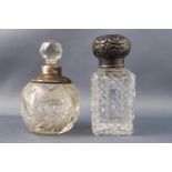 A rectangular cut glass scent bottle with a repousse silver top Birmingham date letter indistinct,