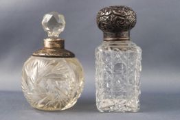 A rectangular cut glass scent bottle with a repousse silver top Birmingham date letter indistinct,