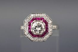 An 18ct white gold diamond and ruby art deco style target ring, centre diamond.