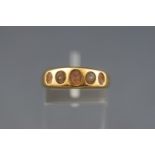 An 18ct gold ring previously set with five pearls (partial remain in setting) stamped 18. Size: O 5.