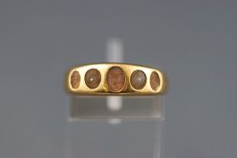 An 18ct gold ring previously set with five pearls (partial remain in setting) stamped 18. Size: O 5.