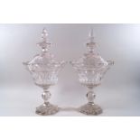 A pair of 19th century cut glass pedestal bowls and covers,