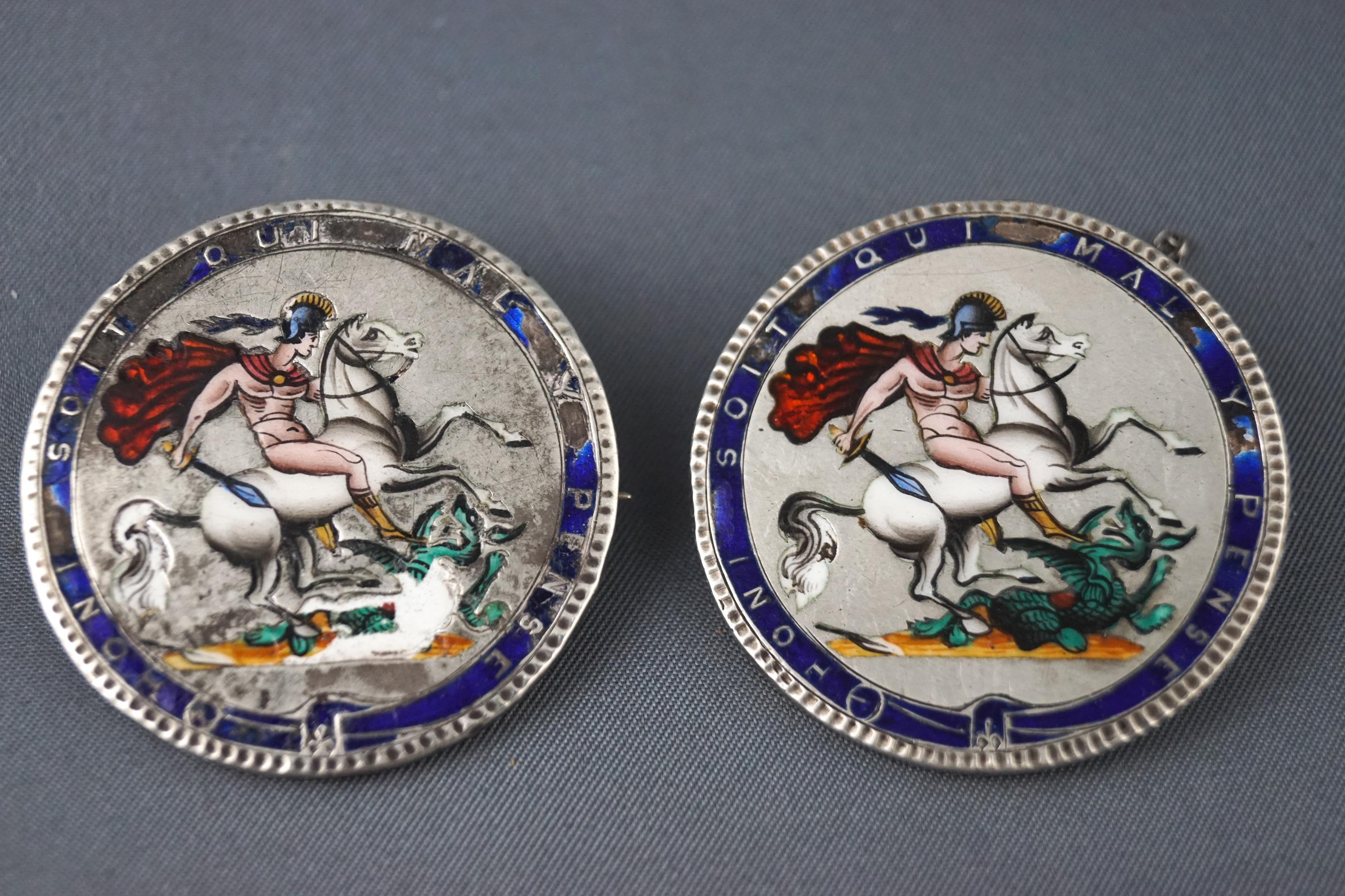 A pair of silver coins,