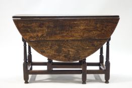 An elm oval gate leg drop leaf table